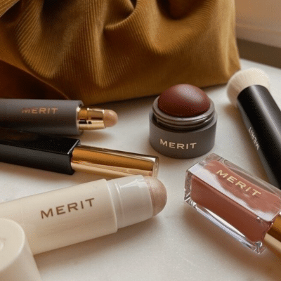 several merit beauty make-up products on a counter